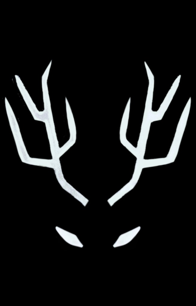 A black background. White eyes and symmetrical antlers pierce through the darkness.
